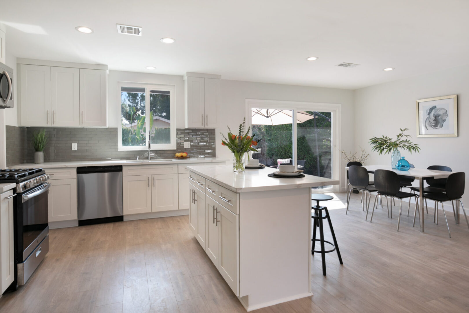 A view of a kitchen and an island