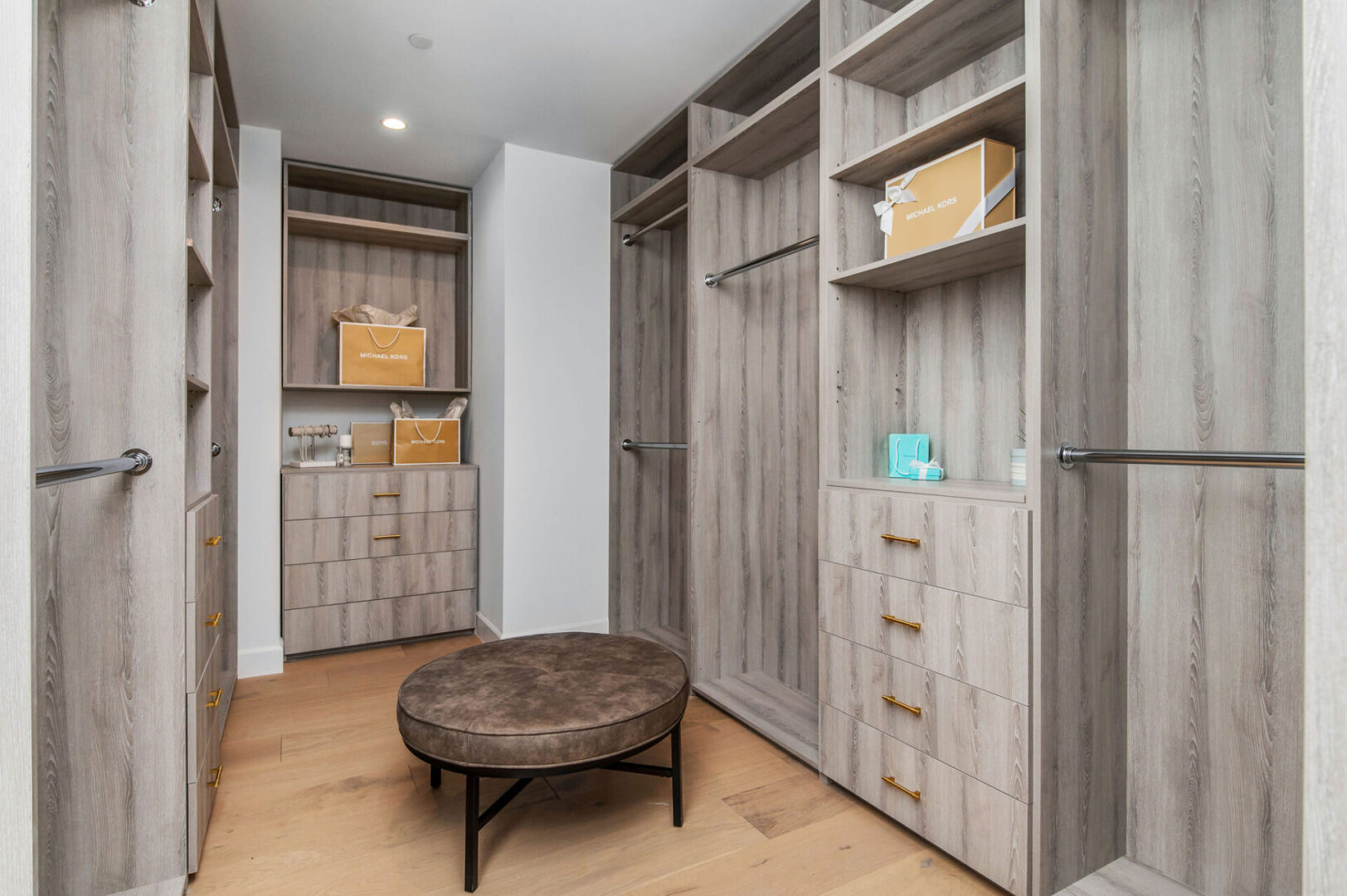 A Parallel Pattern Cabinet Space With Brass Handles