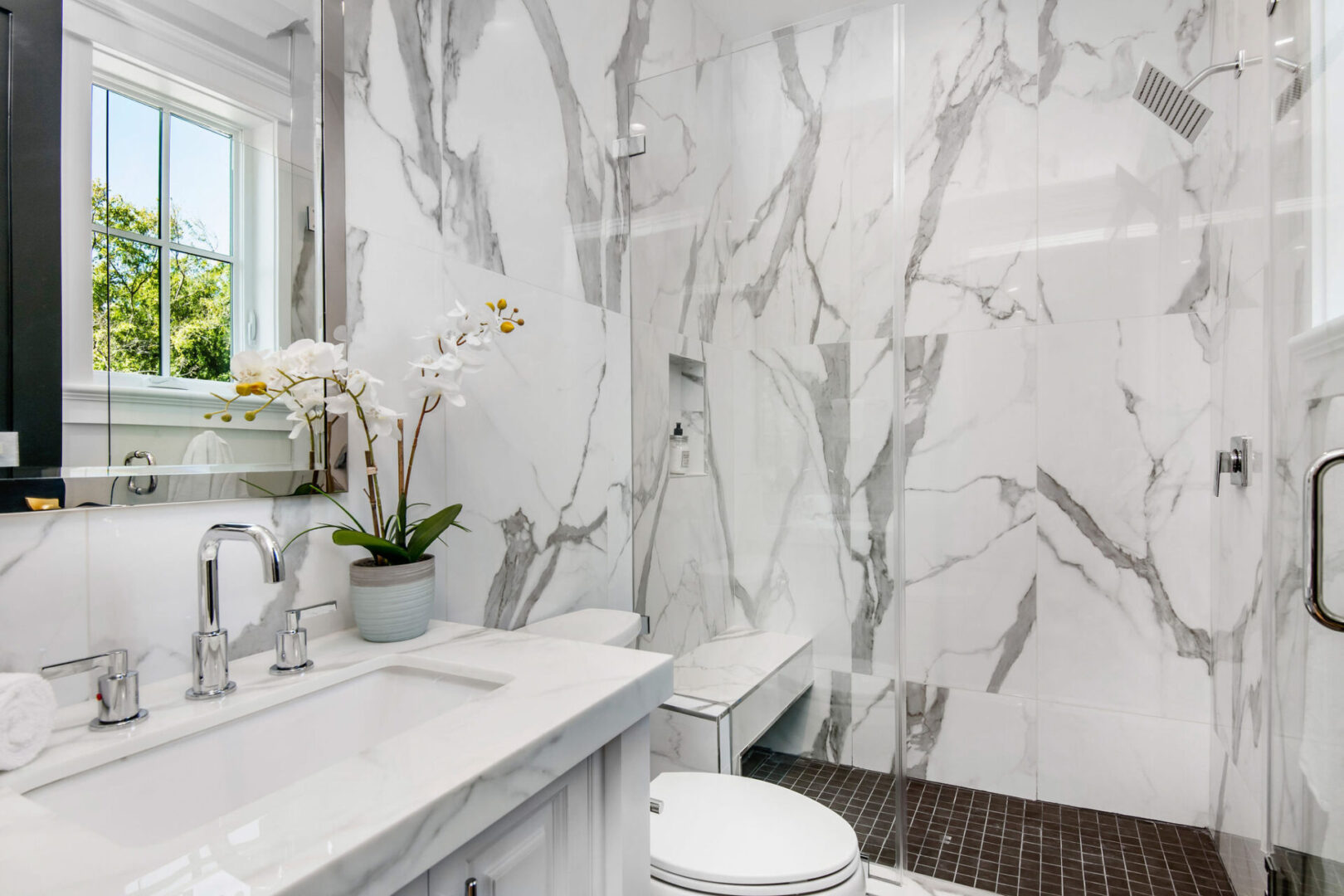 A white marble wall and countertop