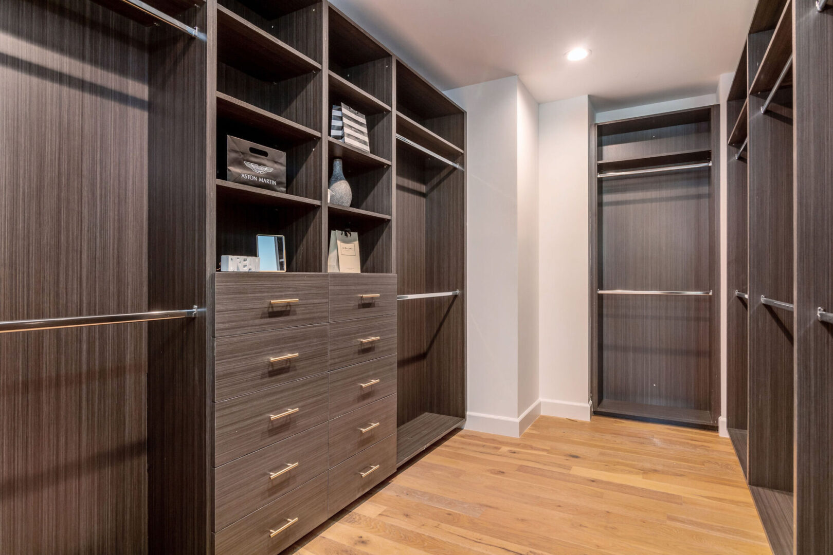 Closet Area With Wooden Doors and Cabinet