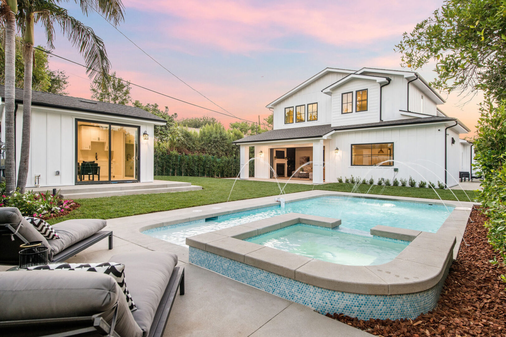 Stylish Pool With Fountain Feature and Sitting Area