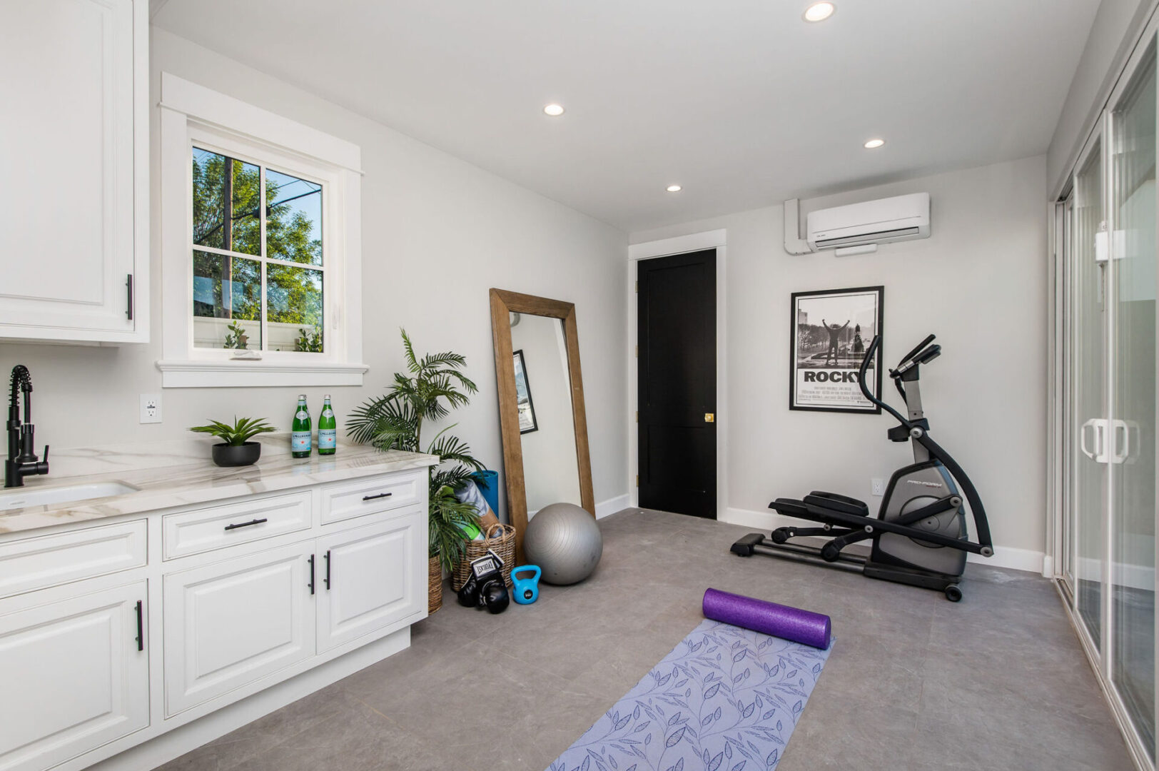 A Home Gym Space With a Full Length Mirror