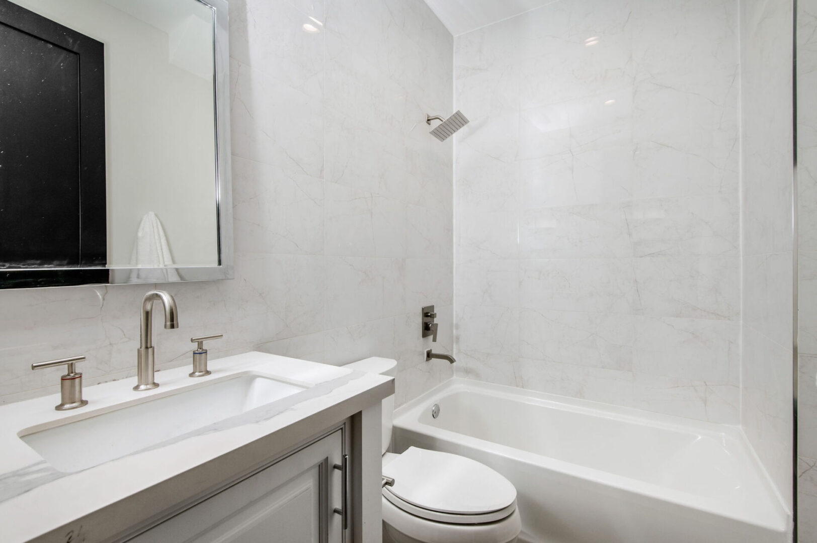 A Bathroom With Stainless Steel Fittings