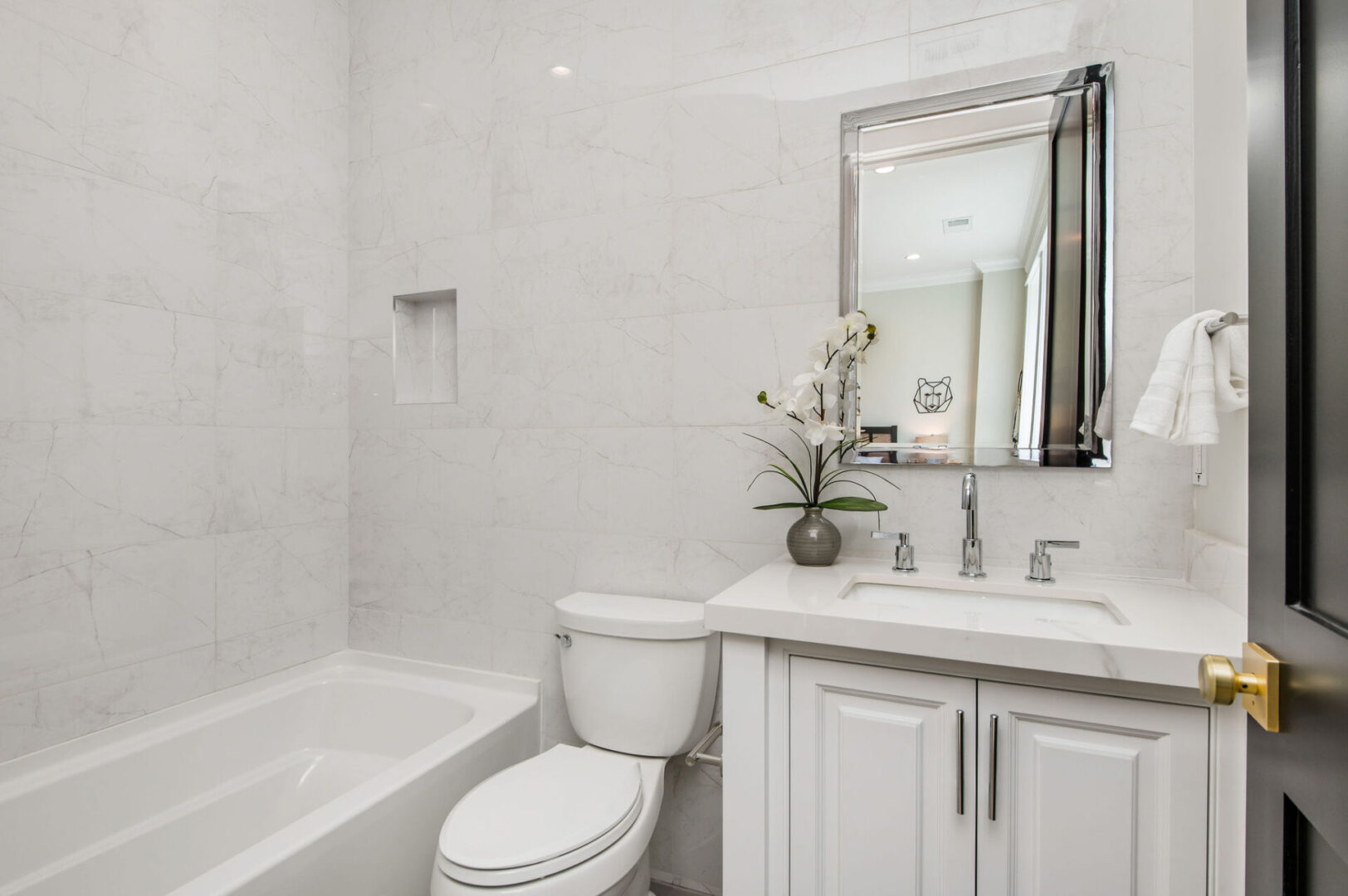 A White Wall and Counter Bathroom