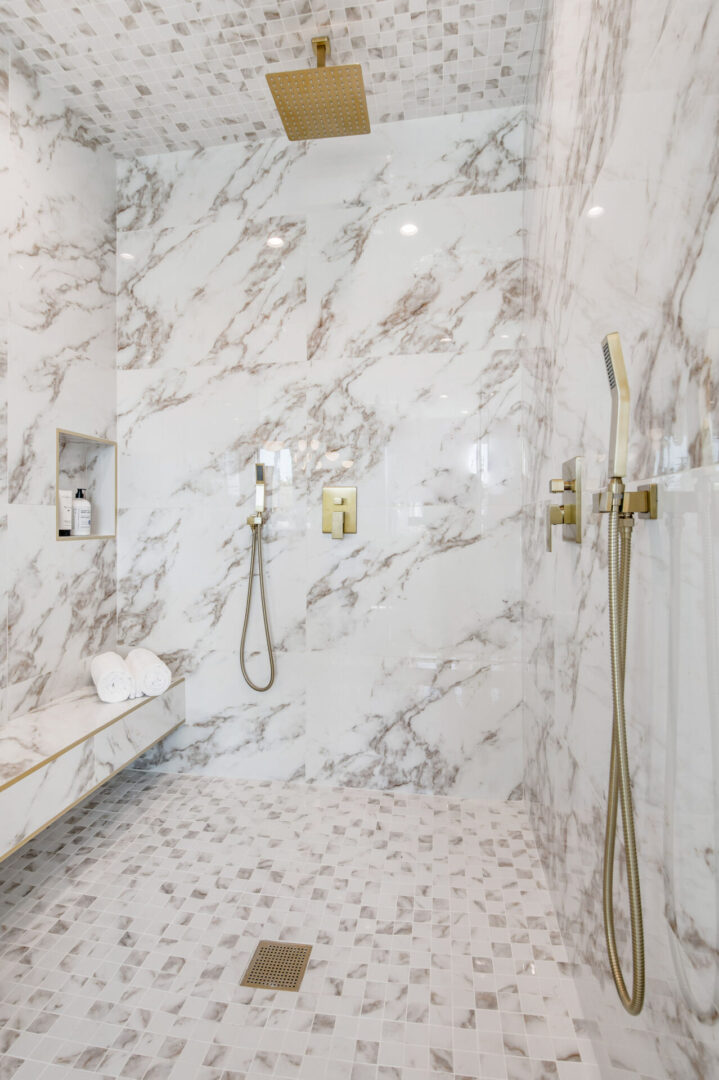 A Shower Cabinet With Gold Plated Fittings