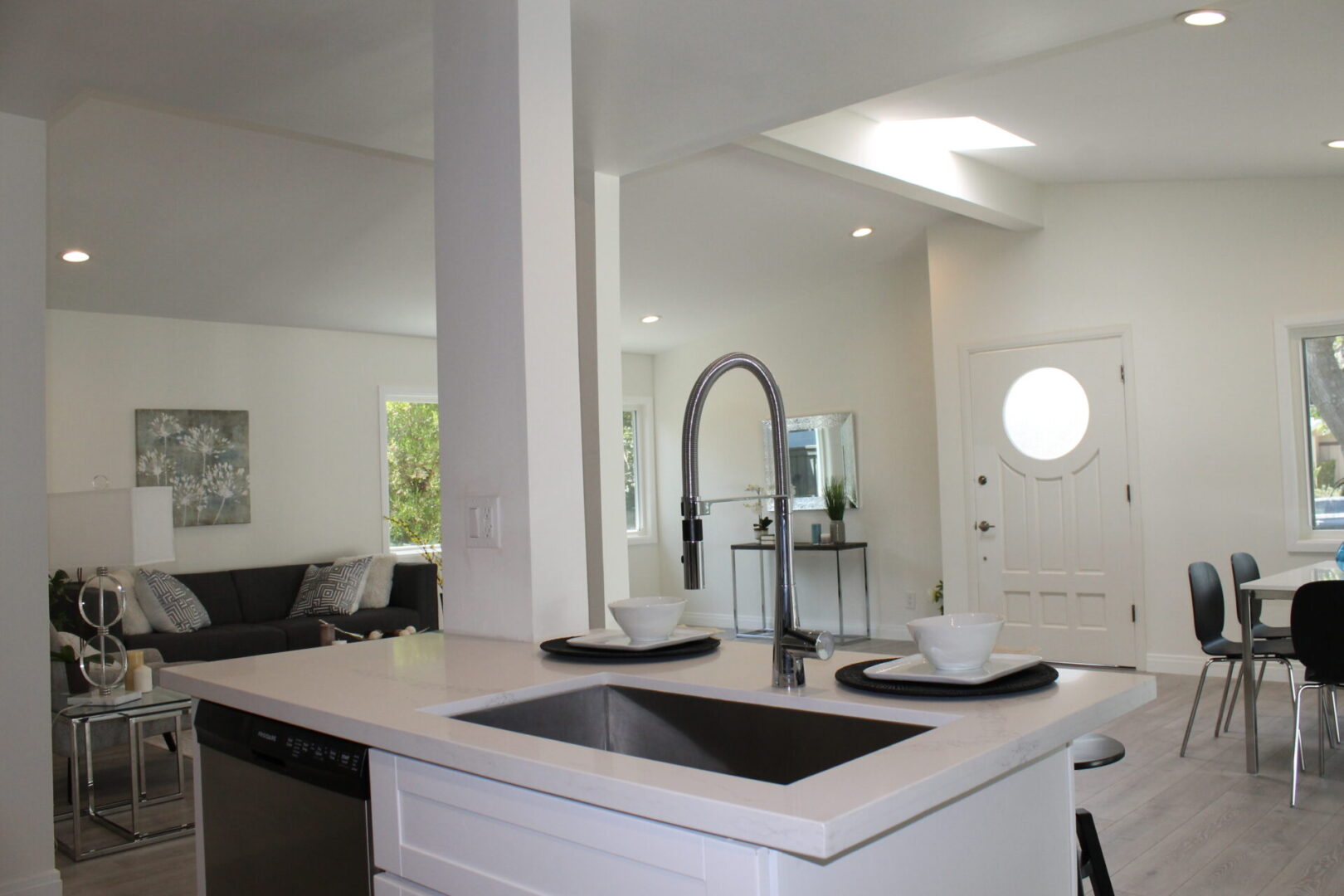 A White Color Island With a Steel Faucet